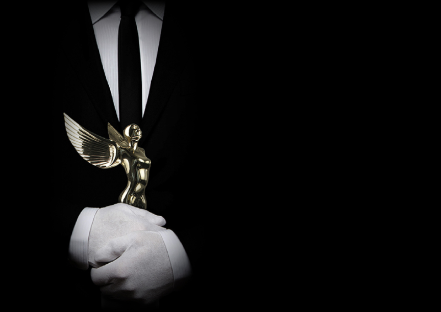 Society Angel Gold being held by white gloves