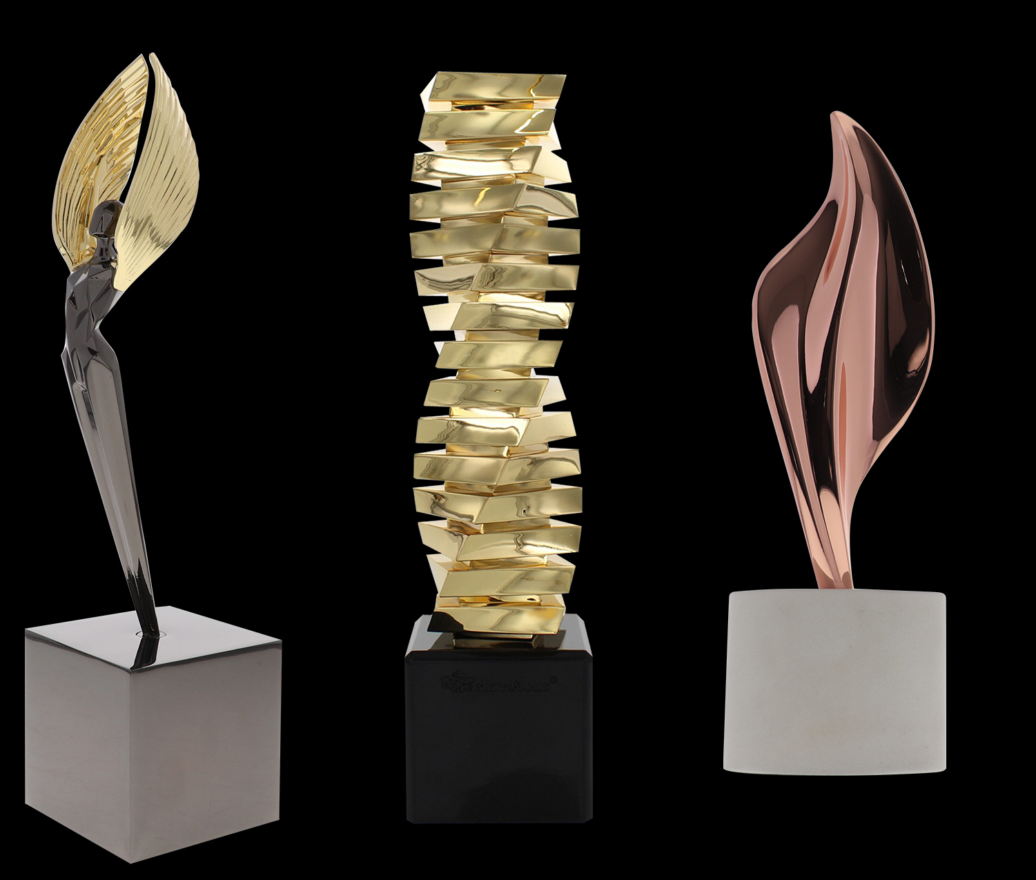 exclusive society award trophies including the gold and glossy black nickel poly angel award, the gold twist award, and the star bird limited award made of rose gold and marble